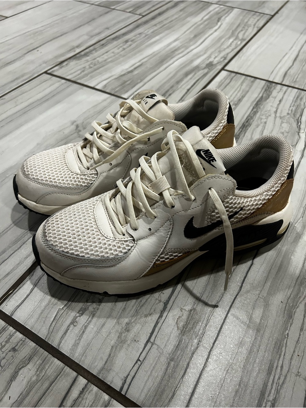 Nike Women’s Cream, Black and Gold Athletic Sneakers